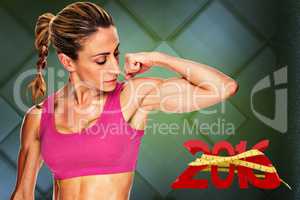 Composite image of female bodybuilder flexing bicep in pink spor