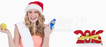 Composite image of festive fit blonde smiling at camera