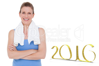 Composite image of fit woman with towel on shoulders