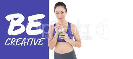 Composite image of attractive woman drinking green juice