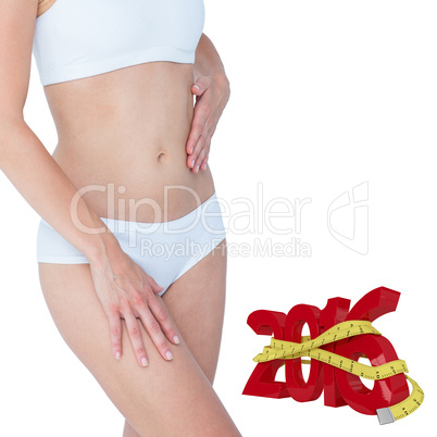 Composite image of pretty blonde touching her belly