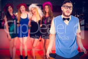 Composite image of geeky hipster showing empty pockets
