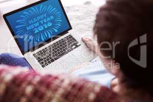 Composite image of pregnant woman using her laptop