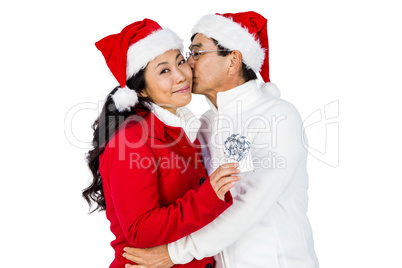 Festive senior couple exchanging gifts