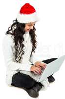 Woman sitting on the floor using laptop