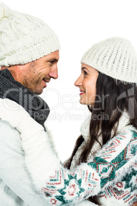 Smiling couple hugging and looking at each other