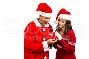 Festive couple exchanging a gift