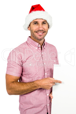 Festive man showing a sign