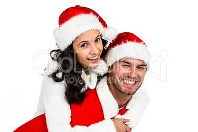 Festive couple smiling at camera