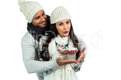 Attractive couple blowing kiss to camera