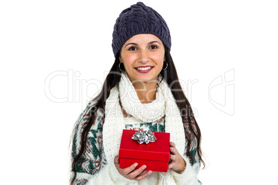 Smiling woman holding red gift box