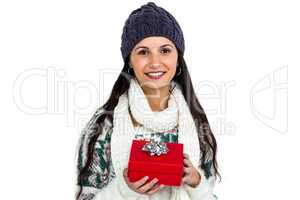 Smiling woman holding red gift box