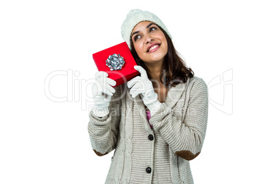 Festive brunette holding a gift