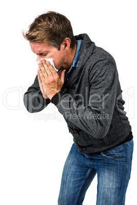 Warmly dressed man blowing his nose