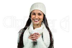 Smiling woman holding white cup