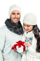 Smiling couple holding gift box