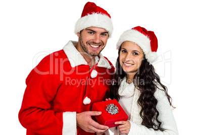 Couple with christmas hats holding red gift box