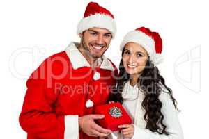 Couple with christmas hats holding red gift box