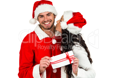 Festive couple exchanging a gift