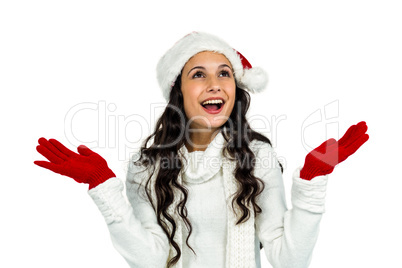 Attractive woman with red gloves looking up with raised hands