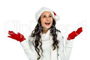 Attractive woman with red gloves looking up with raised hands