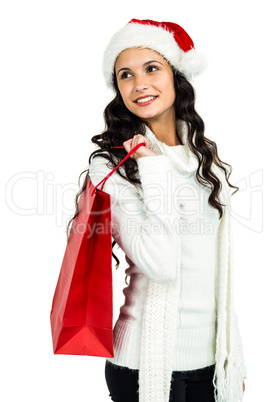 Attractive woman with christmas hat holding red shopping bag