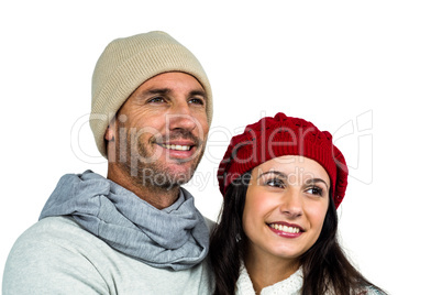 Smiling couple looking away