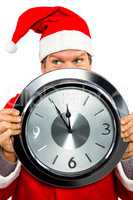 Smiling man in santa costume with clock