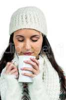 Peaceful woman holding white cup
