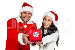 Couple with christmas hats holding red gift box