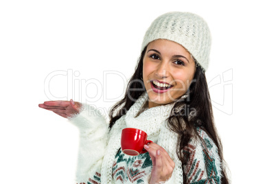 Smiling woman holding little red cup