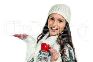 Smiling woman holding little red cup