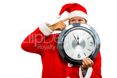 Smiling man in santa costume with clock