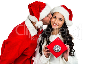 Couple with christmas hats holding red gift box