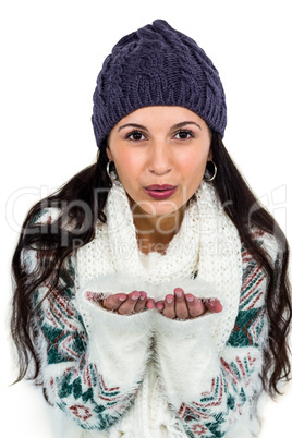 Attractive woman blowing kiss to the camera