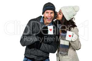 Winter couple enjoying hot drinks