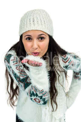 Attractive woman blowing kiss to the camera