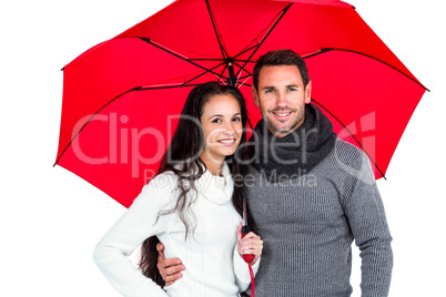 Smiling couple under umbrella