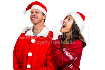 Festive couple looking up together