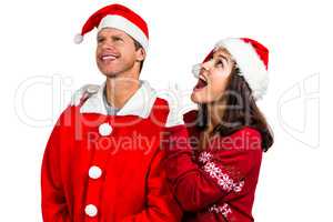 Festive couple looking up together