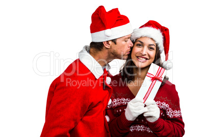 Festive couple exchanging a gift