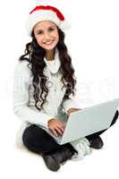 Woman sitting on the floor using laptop