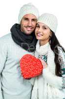 Smiling couple holding gift box