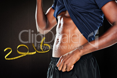 Composite image of mid section of a muscular man showing his abs