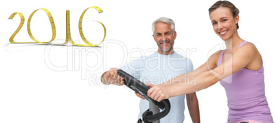 Composite image of portrait of a happy woman on stationary bike