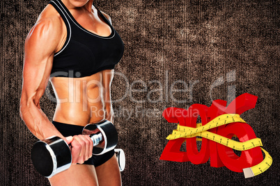 Composite image of female bodybuilder working out with large dum