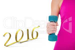 Composite image of fit woman with blue dumbbell