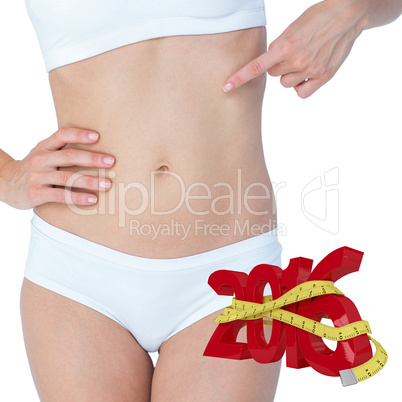 Composite image of attractive woman pointing her belly