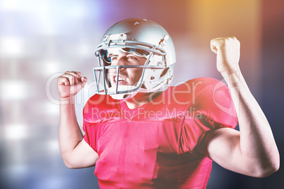 Composite image of happy sportsman cheering with clenched fist