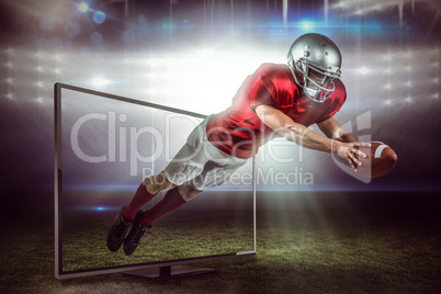 Composite image of american football player scoring a touchdown